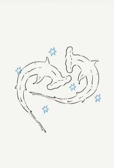 two dolphins swimming in the water with stars on their back and one dolphin jumping out of it's mouth