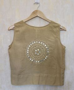 "Sleeveless top for women, Beige linen top, Linen sleeveless top, Linen blouse, Made to order, Custom made, Plus size Hand embroidered linen blouse perfect for a sunny day! Goes best with the trendy linen pants! -Model height: 5'3\" wearing size S -Length: 19.5\" -Fit: Loose -Closure: front hooks The top is hand embroidered with mirror work. This is a one of a kind of hand work called Maggam embroidery. **Note: Free Shipping time 15-21 days. Express Shipping time 5-7 days.**" Beige Cotton Vest Style Top, Beige Cotton Vest Top, Beige Linen Sleeveless Blouse, Sleeveless Beige Cotton Blouse, Beige Sleeveless Cotton Blouse, Beige Sleeveless Linen Top, Cotton Tank Blouse For The Beach, Sleeveless Beige Linen Crop Top, Beige Bohemian Sleeveless Blouse