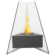 an outdoor fire pit with flames coming out of the top and on it's sides