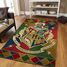 the hogwarts house rug is on display in a living room with wood floors