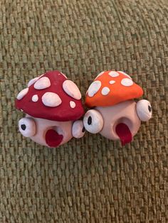 two small mushrooms sitting next to each other