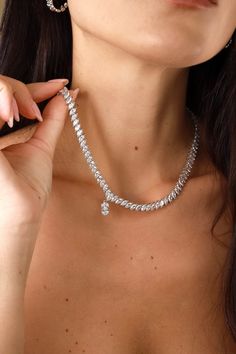 Simply wow. The Constantinople Necklace is crafted in 925 Sterling Silver and features a stunning navette-cut stone that exudes class and timeless beauty. This piece is truly versatile, offering a unique elegance that can be dressed up for special occasions or styled down for an everyday chic look. With a 40cm length and a 5cm extender, the Constantinople Necklace is a must-have addition to any jewelry collection. Key Features: Material: 925 Sterling Silver, with your choice of 14K Gold or Rhodi Timeless Silver Marquise Diamond Necklace, Luxury Marquise Cut Diamond Accent Necklace, Elegant Sterling Silver Diamond Necklace, Elegant Sterling Silver Diamond Necklace With Jewels, Luxury Silver Marquise Cut Necklace, Luxury Silver Marquise Necklace, Silver Marquise Cut Diamond Necklace, Elegant Drop Jewel Necklaces, Elegant Drop Necklaces With Jewels