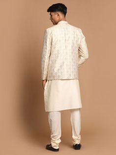 VASTRAMAY Men's Gold Woven Blazer And Cream Solid Kurta With Pajama Set This stylish set features a gold woven blazer paired with a cream solid kurta and pajama. Perfect for festive occasions, weddings, or formal events, this ensemble combines traditional elegance with contemporary flair. Key Features Gold woven blazer with intricate detailing Cream solid kurta with a comfortable fit Matching cream pajama Perfect for festive and formal occasions Specifications Blazer: Single-breasted with button Classic Gold Sets For Festive Season, Classic Gold Festive Sets, Classic Gold Festive Set, Formal Cream Sets With Gold Embroidery, Designer Cream Nehru Jacket For Festive Season, Classic Cream Kurta For Festive Occasions, Designer Off White Festive Sets, Festive Classic Cream Kurta, Festive Beige Set With Gold Embroidery