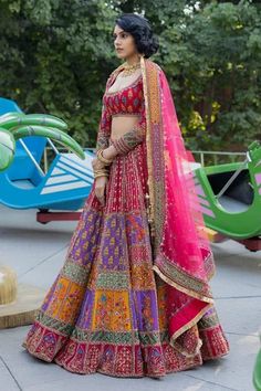 Multi color georgette flared lehenga with attached can-can, all over contrast geometric print panels, beads, metallic gold zari and sequin hand embroidery. Paired with deep round neck embroidered padded blouse with full sleeves and pink net dupatta.
Components: 3
Pattern: Hand Embroidered and Printed
Type Of Work: Bead, Zari, Sequin Work and Geometric Print
Neckline: Deep Round Neck
Sleeve Type: Full Sleeves
Fabric: Georgette, Net
Color: Multi Color
Other Details: 
Fringe tassel border on dupatt Blouse With Full Sleeves, Raw Silk Lehenga, Rakhi Design, Designer Party Wear Dresses, Chaniya Choli, Net Dupatta, Party Wear Dresses, Full Sleeves, Bridal Lehenga