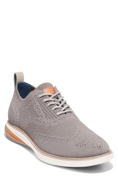 A lightweight knit upper adds a casual chic finish into this lace-up oxford. Sizing: True to size. M=standard width. - Round toe - Lace-up closure - All-over knit wing ox upper. - Dual density EVA midsole with rubber outsole. - Cushioned with GRAND OS for the ultimate in comfort, flexibility and lightness of weight - Imported Textile upper, rubber sole Oxford Sneakers, Mens Oxfords, Lightweight Knit, Versatile Style, Cole Haan, Casual Chic, Nordstrom Rack, Derby, Evolution