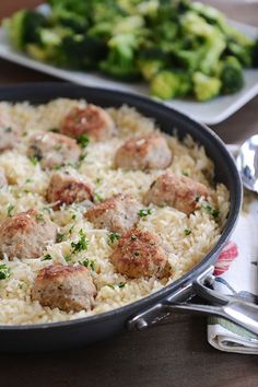 meatballs and rice in a skillet on a table with broccoli behind it