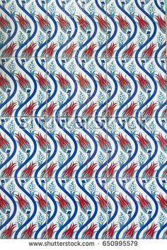 an abstract pattern with red, white and blue colors on the wall in a building