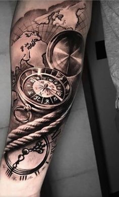 a man's arm with a clock and compass on it