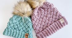 two knitted hats with fur pom - poms on them