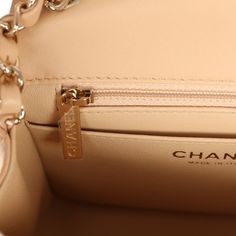 This Mini Square flap bag is in beige lambskin with gold tone hardware and has a front flap with signature CC turnlock closure, rear half moon pocket and single interwoven beige leather and gold tone chain link shoulder/crossbody strap.The interior is lined in beige leather and features a zipper pocket with Chanel pull and an open pocket below.Collection: 2022 (RFID Chip)Origin: ItalyCondition: New and never wornAccompanied by: Chanel box, and Chanel dustbagMeasurements: 6.5" width x 5" depth x 3" height; 22" strap drop Cream Square Bag With Gold-tone Hardware, Square Beige Box Bag With Gold-tone Hardware, Chanel Classic Flap Bag Small Beige, Chanel Classic Flap Small Beige, Chanel Flap Bag Beige, Chanel Box, Chanel Mini, Mini Classic, Birkin 25