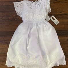 Isabel Garretn White Girls Dress (Size 5) 50% Polyester, 35% Cotton, 15% Rayon Nwt Bin_220 Fitted Short Sleeve Lace Dress For Dress-up, Fitted Short Sleeve Lace Dress For Dress-up Occasions, Fitted Lace Dress With Short Sleeves For Dress-up, Spring Fitted Lace Dress For First Communion, Fitted Lace Dress For First Communion In Spring, Fitted White Lace Dress For Dress-up, Spring First Communion Fitted Lace Dress, White Fitted Lace Dress For Dress-up, White Fitted Baptism Dress For Dress-up