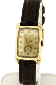 Luxury Antique Watch With Rectangular Dial, Luxury Vintage Watch With Polished Finish, Luxury Antique Brown Watches, Luxury Vintage Rectangular Watch Accessories, Retro Rectangular Formal Watches, Retro Rectangular Watches For Formal Occasions, Retro Gold Watches With Rectangular Dial, Retro Gold Watch With Rectangular Dial, Vintage Yellow Gold Rectangular Watch