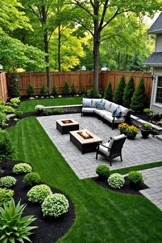 an outdoor patio with seating and landscaping in the back yard, surrounded by green grass