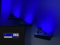 the shoes are lit up by blue lights on the wall and below them is a sign that says lightning