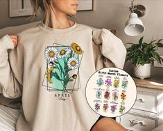 Custom Birth Month Flower Sweatshirt, Flower Sweatshirt, Personalized Flower Sweater, Birthday Month Shirt, Birthday Shirt, Mothers Day Gift Welcome to AuroraConceptDesign! ❤️ 👉🏻 PROCESSING TIME: - 3-5 business days. - Please contact us if there is a rush order. 👉🏻 DELIVERY TIME: - Standard Shipping:  3-5 business days - Expedited Shipping  1-3 business days 👉🏻 CARE INSTRUCTIONS: - Machine wash cold and tumble dry low.  - Do not iron directly onto the design. - Do not bleach. We offer a wide variety of products, including Unisex T-shirts, Women's V-neck T-shirts, Unisex Long Sleeve T-shirts, Youth T-shirts, Toddler T-shirts, and many more. Swipe listing images and check all the colors available for each type of shirt. Please enter the shirt and text color desired for your shirt in th Spring Crew Neck Sweatshirt, Crew Neck Sweatshirt For Spring, Spring Crew Neck Sweatshirt For Gift, Spring Cotton Sweatshirt Gift, Spring Long Sleeve Sweatshirt, Spring Birthday Crew Neck Top, Letter Print Tops For Birthday In Spring, Spring Cotton Sweatshirt With Custom Print, Spring Birthday Custom Print Tops