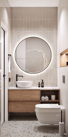 a bathroom with a toilet, sink and mirror in it's centerpieces