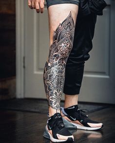 a man with a tattoo on his leg