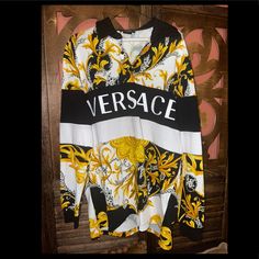 Black/White/Gold-Tone Cotton Mixed-Print Long-Sleeve Polo Shirt From Versace Featuring Logo Print At The Chest, Polo Collar, Long Sleeves And Mixed Print. Condition: Excellent Condition Only Used Once !!! Please Revise Pictures Carefully, A Few Minor Spots On Sleeve And On Middle White Center. I’m Sure Dry Cleaning Will Solve That Off. This Is Sold Out Everywhere !!!!! Versace Shirts, Black White Gold, Long Sleeve Polo Shirt, Long Sleeve Polo, Mixing Prints, Polo Collar, Logo Print, Versace, Polo Shirt