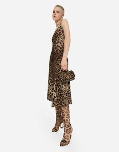 Leopard-print calf-length cady dress: Animal print Round neck Sleeveless Unlined Invisible zipper and hook-and-eye fastening on the back The piece measures 80 cm from the waist down on a size IT 40 The model is 175 cm tall and wears a size IT 40 Made in Italy The difference in the print placement that you may find on this product is a feature of Dolce & Gabbana’s “Handmade” pieces. A detail that makes every garment or accessory unique and exclusive. Elegant Leopard Print Midi Dress For Evening, Elegant Sleeveless Leopard Print Midi Dress, Sleeveless Leopard Print Evening Dress, Dolce And Gabbana Leopard, Casual Leopard Print Knee-length Dress, Dress Animal Print, Dolce And Gabbana Leopard Print, Dolce And Gabbana Cheetah Dress, Chic Leopard Print V-neck Midi Dress