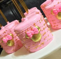 pink and gold suitcases with bows on them