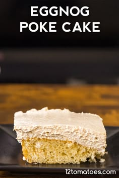 a piece of eggnog poke cake on a black plate