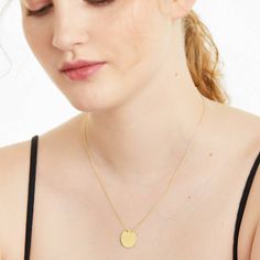 This sophisticated 14K yellow gold pendant features a polished disk on a diamond cut 16 cable chain with 2 extender that closes with a lobster claw clasp. *Pendant dimension: 17mm Disk Necklace, Disc Necklace, Yellow Gold Pendants, Diamond Cut, Cable Chain, Lobster Claw, Precious Metals, Gold Pendant, Diamond Cuts