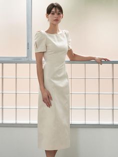 This product is a meticulously tailored Emma boat neck dress that offers a sophisticated and timeless look. The dress is designed with elegant short sleeves and a form-fitting silhouette that gracefully accentuates the natural curves. Perfect for formal occasions, this dress is a classic piece with a modern edge. - The dress features a boat neckline that elegantly highlights the collar area.- Its short sleeves are designed with a gentle puff, adding a touch of refined femininity.- The form-fitting silhouette of the dress is crafted to enhance and flatter the body's natural shape.- A discrete back zipper allows for a seamless look and easy wear. Boat Neck Dress Designs, Dress With Necklace, Boatneck Dress, Model Clothes, Boat Neck Dress, Model Outfits, Natural Curves, Boat Neckline, Everyday Dresses