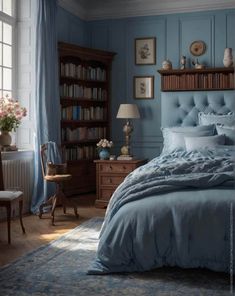 a bedroom with blue walls and furniture in the corner, along with bookshelves