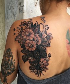 a woman's back with flowers on it