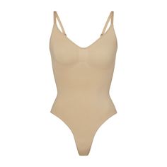 The Sculpting Thong Bodysuit holds in your core, supports your chest, and cinches your waist. High cut leg opening and thong back make it the perfect invisible sculpting piece. Snap gusset closure. | SKIMS Sculpting Thong Bodysuit | Light Neutral | Large/XL | Seamless Sculpt Sculpting Bodysuit, Toddler Suits, Body Confidence, Shapewear Bodysuit, Suits For Sale, Body Shapers, Black Bodysuit, Cinched Waist, Bra Sizes