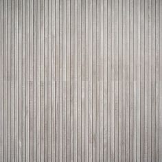 a white wall with vertical lines painted on it