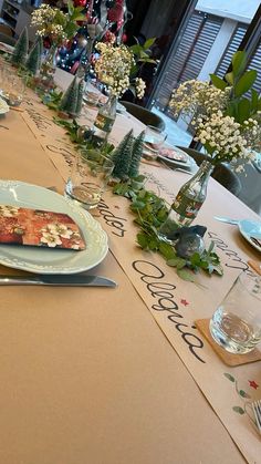 a long table with plates and silverware on it