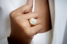 An exquisite piece from our handcrafted selection of 14k rings for women - stunning Pearl ring elegantly crafted in 14k yellow gold-filled setting. Express yourself or your affection and love for someone special with this statement ring. ☛ 𝒜𝐵𝒞 - Add Engraving - https://etsy.me/2ZSRjhu ☛ Ring size - Select the size you would like from the drop down menu ♥ Gemstone Type - Mother Of Pearl ♥ Gemstone Size - 16mm ♥ Gemstone Cut - Round ♥ Metal Type (Main Photo) - 14k Gold Filled - Other options av Elegant Yellow Gold Moonstone Ring With Bezel Setting, Luxury White Moonstone Ring For Wedding, Luxury White Moonstone Promise Ring, Elegant White Filigree Promise Ring, White Round Cut Filigree Ring For Gift, White Filigree Ring With Round Cut - Perfect Gift, Elegant Moonstone Ring With Halo Design As Gift, Elegant Gold Moonstone Promise Ring, Elegant White Filigree Ring With Rose Cut Diamonds