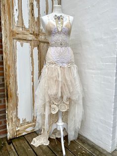 Boho wedding dress in a fairy look,bridal gown with RAW edges, unique wedding dress in colours , rustic boho wedding dress, barefeet beach wedding dress , elven wedding dress.. I truly loved making this unique , delicate but still very strong silk dress. I have played with the colors white and dusty light rose and put it all together for a special look which really touched my soul. I feel the dress is a wonderful bohemian vintage inspired dress in calm colors giving it an ethereal feeling and lo Fairy Style Wedding Dress For Summer, Summer Wedding Fairy Dress, Fairy Style Summer Wedding Dress, Summer Fairy Style Wedding Dress, Beach Wedding Dress With Delicate Lace, Whimsical Fitted Fairy Dress For Wedding, Whimsical White Fairy Dress For Wedding, White Fairycore Dress For Wedding, White Fairycore Fairy Dress For Wedding