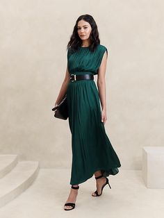 Chic Pleated A-line Dress, Green Evening Dresses With Accordion Pleats, Chic Green Dress With Pleated Back, Chic Draped Dress With Pleated Waist, Chic Pleated Waist Maxi Dress For Night Out, Chic Midi Dress With Folds For Work, Green Pleated Draped Dress, Chic Pleated Bodice Dress For Work, Chic Pleated Dress For Work