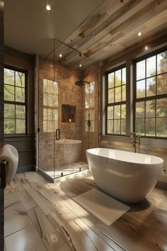 a bathroom with a large bathtub and wooden floors