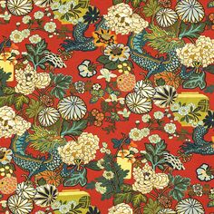 a red background with many flowers and birds on it's sides, all in different colors