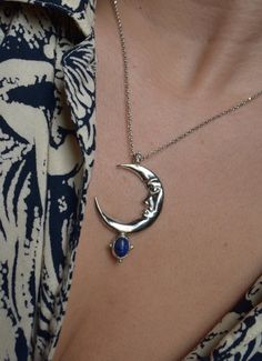 In the Ancient mythology Zirna was an Etruscan goddess of the waxing moon. The moon is the symbol of the soul, the closet celestial body of the planet Earth. This is a sculptural pendant, carved in wax, casted in Sterling silver, set with a beautiful Lapis Lazuli gemstone & polished to a beautiful burnished silver finish. It is harmonized with a high quality long silver cable chain. Circumference is 42 cm. Looks great layered on it's own but do not hesitate to pair it with other chain necklaces Sterling Silver Sun And Moon Spiritual Necklace, Sterling Silver Spiritual Necklace With Sun And Moon Design, Spiritual Sterling Silver Necklace With Sun And Moon Design, Spiritual Sterling Silver Sun And Moon Necklace, Celestial Sterling Silver Jewelry For Meditation, Sterling Silver Celestial Jewelry For Meditation, Spiritual Silver Crescent Necklace, Spiritual Crescent Moon Phase Necklaces, Spiritual Crescent Moon Phase Necklace