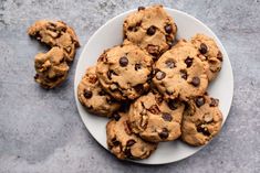 a plate full of chocolate chip cookies on a table