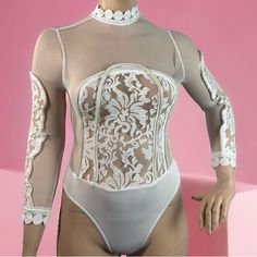 Women’s Banjul Burn Out Mesh Lace Roped Body Suit-White 93% Polyester 7% Spandex Beautiful Lace Roped Trim Design Decorative Embroidered High Neck Lightweight/Stretchable Material White Bodycon Bodysuit For Parties, Cream Fitted Bodysuit With Lined Body, High Stretch White Bodysuit For Spring, Fitted Cream Bodysuit With Lined Body, White Sheer Stretch Bodysuit, White Stretch Party Top, White Stretch Top For Party, White Bodycon Bodysuit For Spring, White Fitted Bodysuit For Party