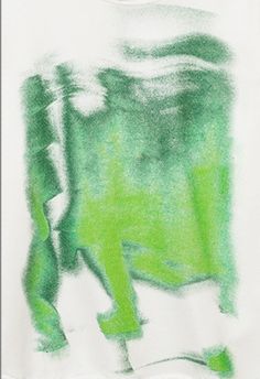 a drawing of a person walking down the street in green and white ink on a t - shirt