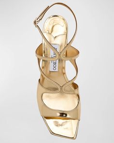 Jimmy Choo Azilia Strappy Metallic Sandal in Gold Square open toe Adjustable ankle strap Caged vamp Metallic faux leather upper, lining, and sole 1.75” (45 mm) block heel Made in Spain Metallic Sandals, Matte Gold, Wedding Shoes, Leather Sandals, Jimmy Choo, Ankle Strap, Block Heels, Open Toe, Leather Upper