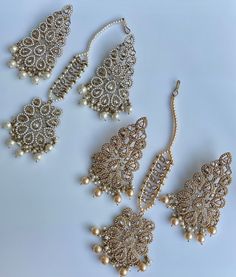 These gorgeous sets of tikka and jhumka come in 2 beautiful colors and are pastel tones to match any outfit. The multi set is a subtle mix of colors to create a uniform look and the champagne is the perfect single pop of color for any outfit! Comes as a set of earrings and headpiece (tikka) Elegant Sets With Latkans For Celebration, Elegant Celebration Sets With Latkans, White Tikka For Party And Festive Occasions, Festive White Tikka For Parties, White Festive Party Tikka, Elegant Chandbali Sets With Matching Earrings, White Tikka For Eid Party, Party Bridal Earrings With Stone Work, White Party Tikka With Latkans