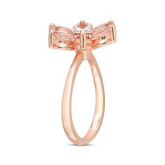 This blushing ring displays an array of peachy pink, pear-shaped morganites arranged to resemble flower petals. A bezel-set diamond accent glimmers at the center for a touch of sparkle. The ring is crafted in pretty 10K rose gold. Formal Pink Flower-shaped Rings, Rose Gold Cubic Zirconia Flower Ring For Formal Events, Formal Fine Jewelry Blush Rings, Elegant Pink Cluster Ring With Rose Cut Diamonds, Elegant Pink Rose Cut Diamond Cluster Ring, Elegant Pink Oval Flower Ring, Formal Pink Flower Shaped Ring, Rose Gold Flower Ring With Halo Setting, Fine Jewelry Rose Gold Flower Ring With Halo Setting