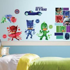 the wall decals in this child's bedroom are designed to look like superheros