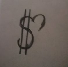 a dollar sign drawn on top of a piece of paper