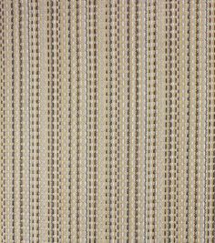 a beige and brown striped rug with small circles on the top, in front of a white background