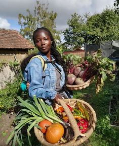 a woman holding a basket full of vegetables