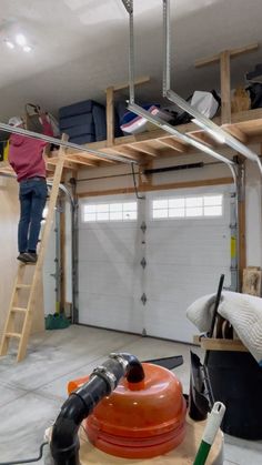 elandashwoodshop on InstagramWhen I built this extra storage above my garage doorsI wanted a lite weight ladder to grab and move around as neededI threw this… Diy Overhead Garage Storage, Diy Garage Work Bench, Garage Storage Inspiration, Garage Organization Tips, Garage Organisation, Overhead Garage Storage, Garage Workshop Organization, Garage Renovation, Garage Storage Shelves