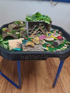 a table that has various items on it with writing on the top and below them